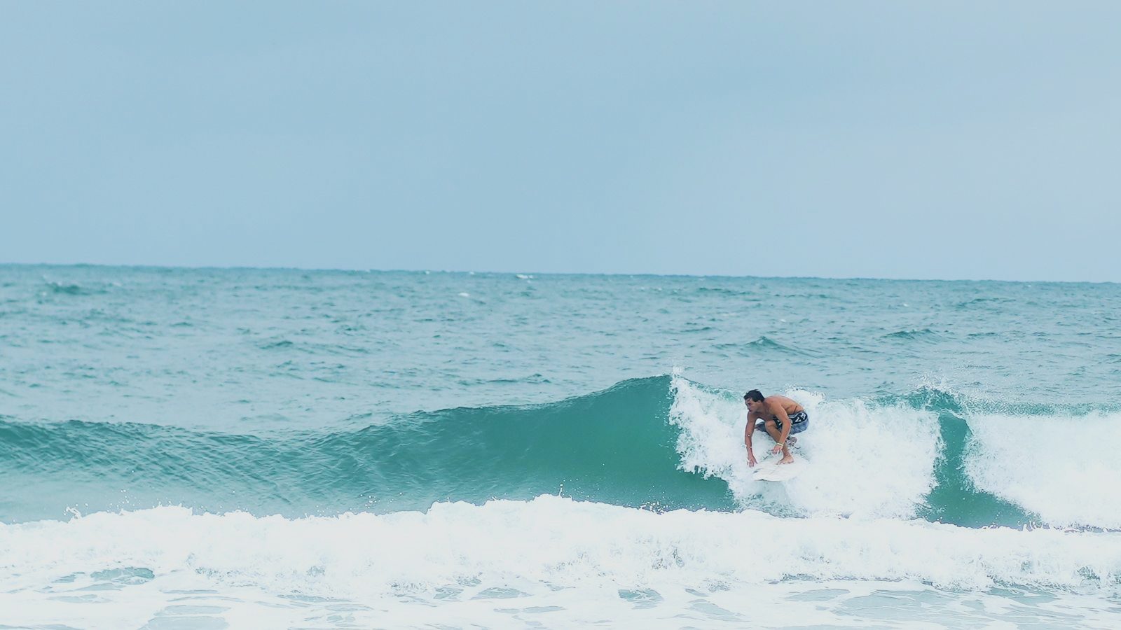 Shepp driving through a bottom turn under the lip